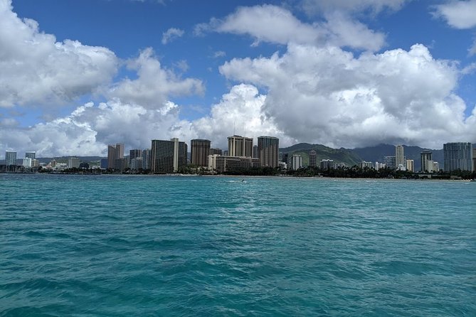 12pm Turtle Canyon Snorkel Adventure - Sailing after snorkeling: Diamond Head and Waikiki from the water