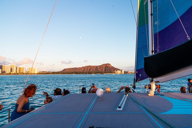 Board from Waikiki Beach for a scenic Sunset Sail on the Hāwea - The Pace of a 90-Minute Sail: Music, Wind, and a Clean End to Your Day
