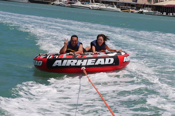 Combo Banana Boat Ride and Bumper Tube Ride in Hawaii - Banana boat tow: grip, wake crossings, and the Chad factor