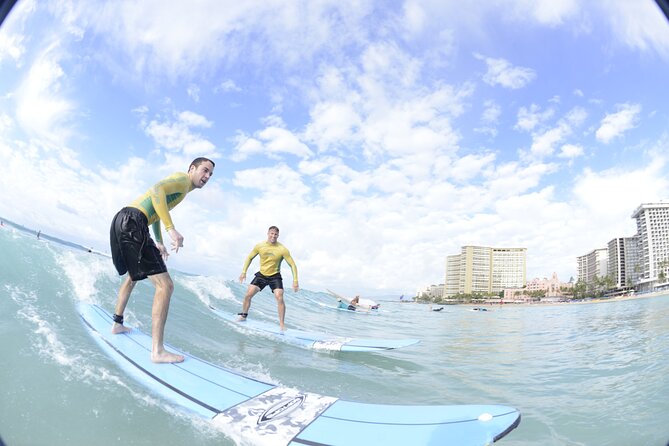 Semi-Private Surf Lesson for 2 or 3 people on Waikiki Beach - Land Demo to Ocean Safety: Learning Board Control and Paddling