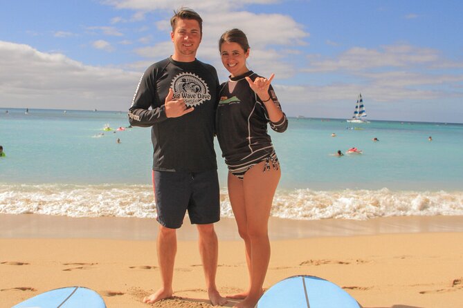 Semi-Private Surf Lesson for 2 or 3 people on Waikiki Beach - In the Water: Catching Waves with Support (and Taking Safety Seriously)